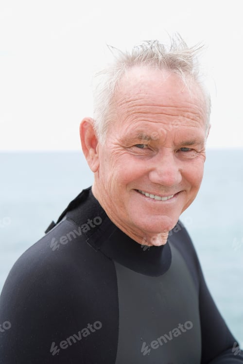 Preview: Close-Up Portrait Of A Man In Wetsuit By The Beach.