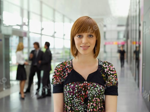 Preview: Headshot Of A Young Businesswoman With Red Hair Looking Confidently At The Camera.