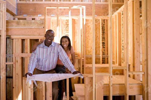 Preview: Horizontal Shot Of A Young Couple With Blueprints In A Partially Built House.