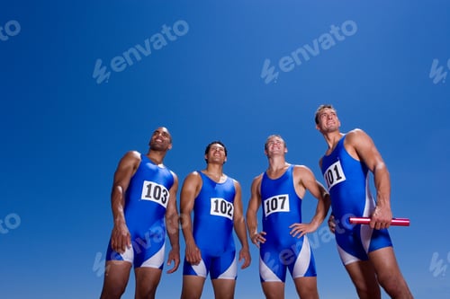 Preview: Young Male Athletes Posing And Smiling On A Bright, Sunny Day At An Athletics Competition Out At