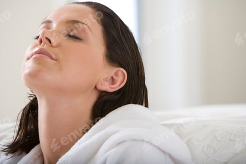 Preview: Horizontal Head And Shoulder Portrait Of A Young Woman Wearing A White Bath Robe Enjoying The Bliss