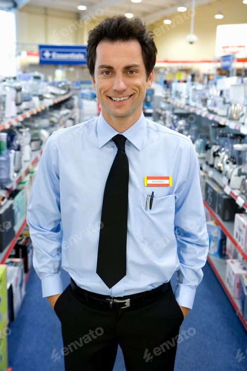 Preview: Vertical Shot Of A Young Man Standing With His Hands In His Pockets In The Middle Of The