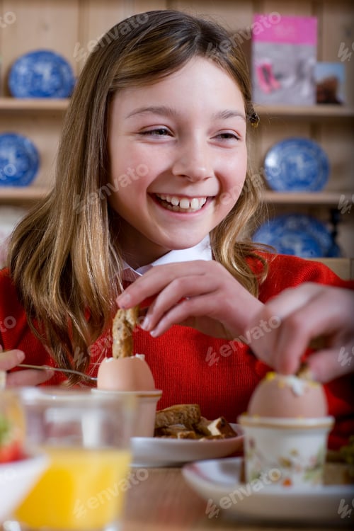 Preview: Tight Shot Of A Girl In School Uniform Having Breakfast With A Smile And Wooden Shelf In The
