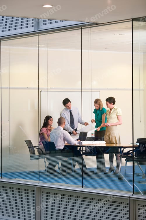 Preview: A Team Of Five Young Business People Having A Meeting In The Boardroom At Their Workplace