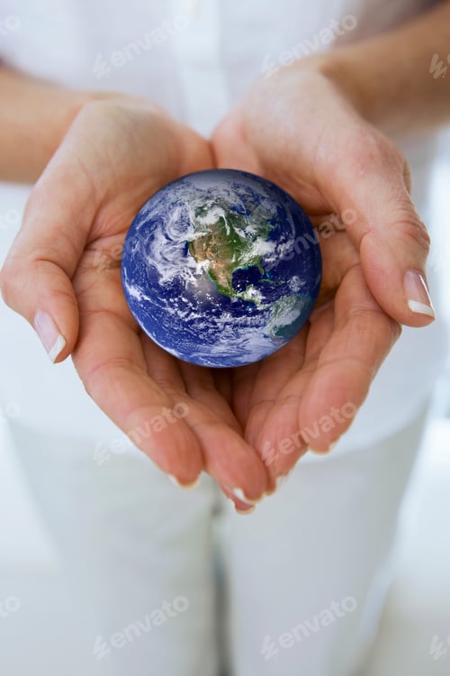 Preview: Horizontal Shot Of The Woman'S Hand Holding Miniature Globe In Her Palms.