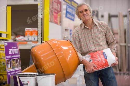 Preview: Horizontal Three Quarter Length Portrait Of A Joyous Man Looking At Camera Holding A Cement Bag
