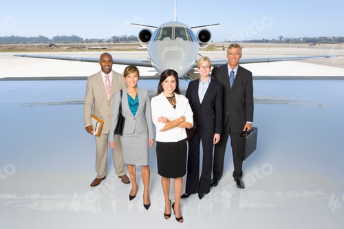 Preview: Elevated View Of A Small Group Of People Standing In Line Behind A Woman In Front Of A Private Jet.
