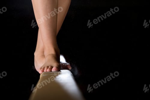 Preview: Bare Feet on Balance Beam against Black Background