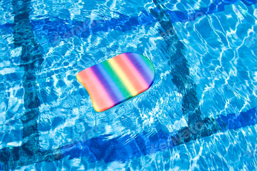 Preview: Close-Up Shot Of A Paddleboard Floating In The Swimming Pool.