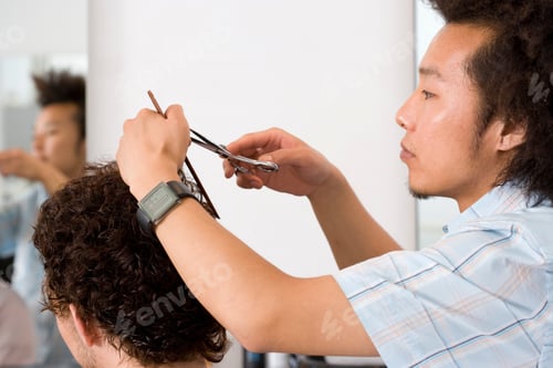 Preview: Head And Shoulder Profile Shot Of A Barber Cutting Client'S Hair.