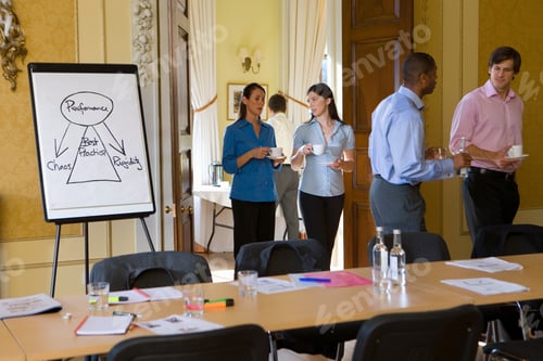 Preview: Group Of Business People Entering The Conference Room With Cups Of Tea In Their Hands And Talking