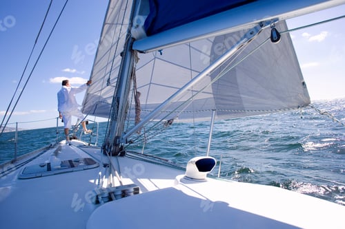 Preview: Senior Man Standing At The Bow Of A Yacht Out At Sea And Looking At The View On The Horizon