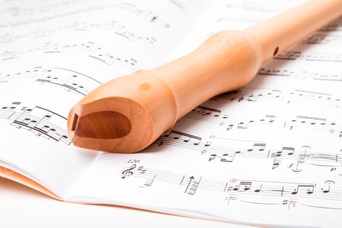 Preview: Wooden Flute On Sheet Music. Close Up.