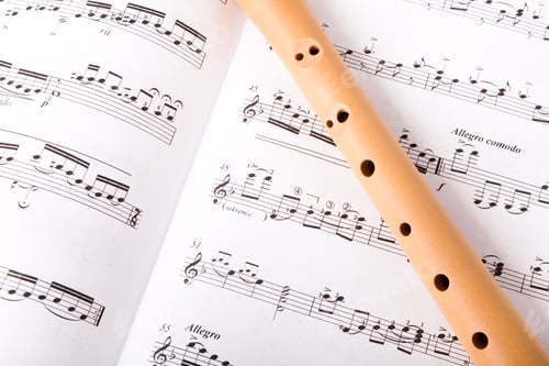 Preview: Wooden Flute On Sheet Music. Close Up.