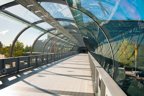 Preview: Modern Glass Walkway in Urban Area during Daytime