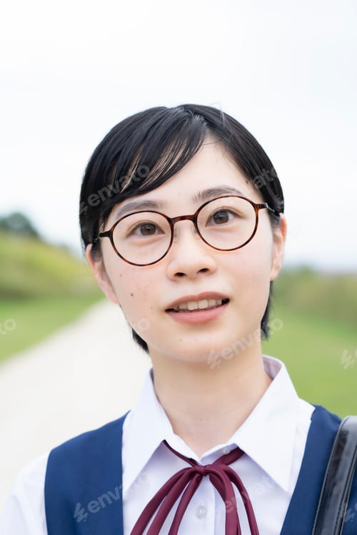 Preview: Asian Female High School Student Wearing Uniform And Smiling Outdoors