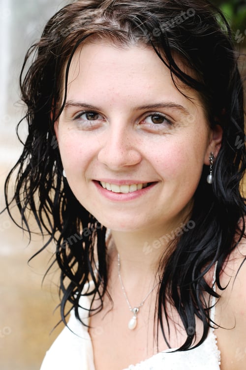 Preview: Close-Up Of A Happy Brunette Woman With Wet Hair.