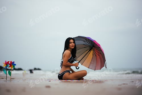 Preview: Sexy Beautiful Asian Woman On Beach Summer Vacation In Bikini Sitting On Sand In Holiday.