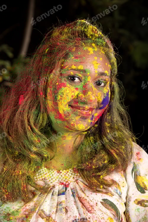 Preview: Portrait Of Happy Young Girl On Holi Color Festival. Girl Posing And Celebrating Festival Of Colors.