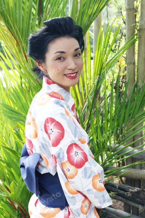 Preview: Portrait Of A Happy Japanese Woman Dressed In Kimono.