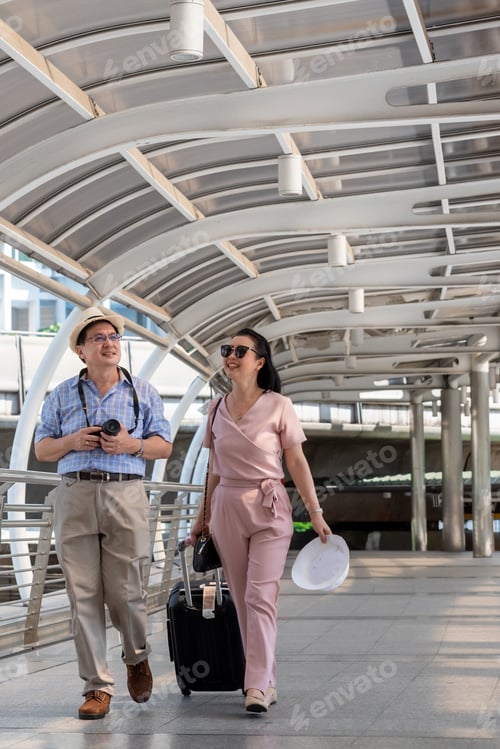 Preview: Smiling Couple Walking On Bridge In City