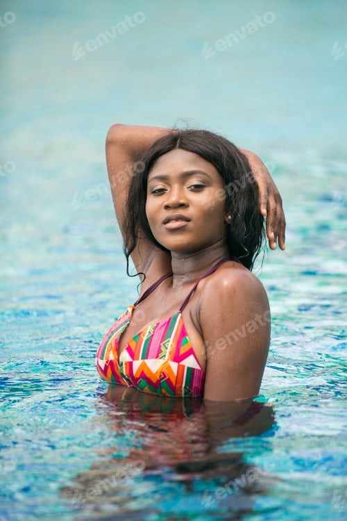 Preview: African Woman In The Swimming Pool During Summer Vacation.