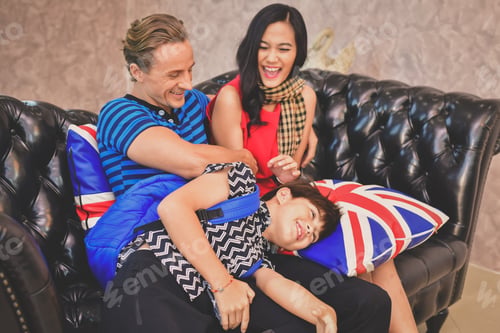 Preview: Family Concept. Family Is Happy In The House. The Family Is Playing In The Living Room. The Family