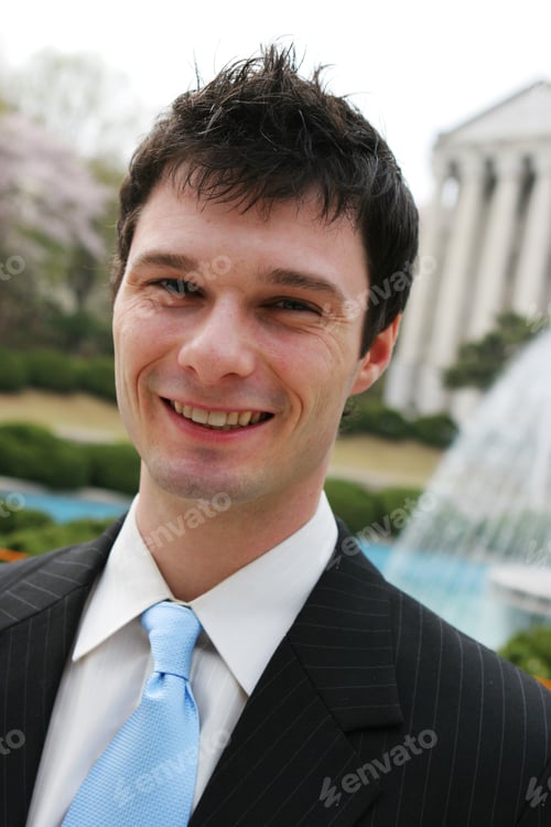 Preview: Close-Up Portrait Of A Young Attractive Executive Smiling.