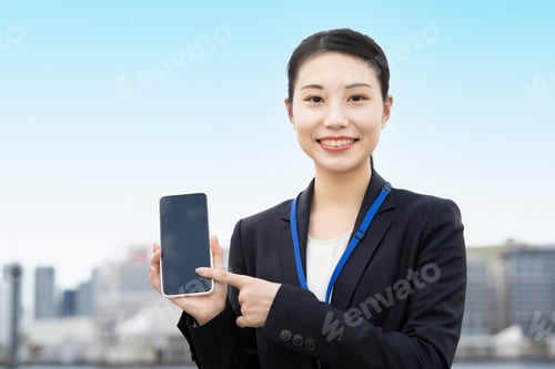 Preview: Business Woman Operating A Smartphone