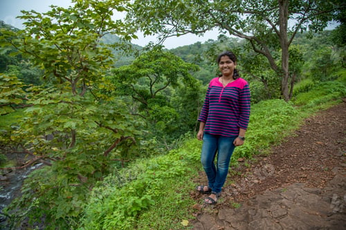 Preview: A Beautiful Young Woman Posing At The Bank Of The River And Mountain Range.