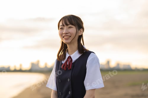 Preview: Asian Female High School Student Walking On The Beach