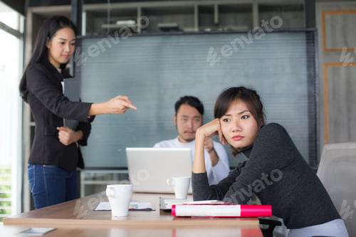 Preview: Asian Business Woman Feeling Bored For Project With Team Meeting.