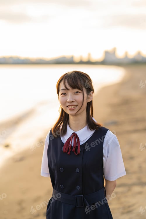 Preview: Asian Female High School Student Walking On The Beach