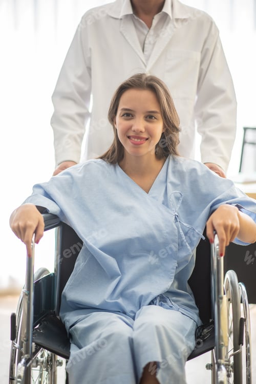 Preview: Portrait Of Female Patient Sitting In Wheelchair In Hospital