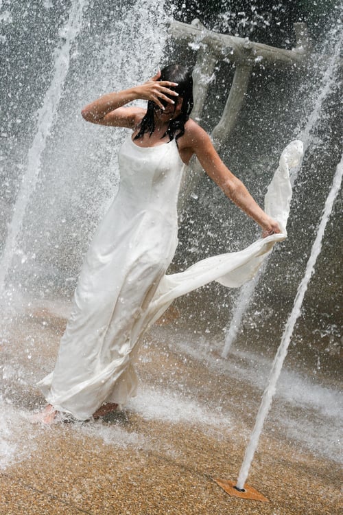 Preview: Beautiful Young Bride Playing In A Waterfall On Her Wedding Day.