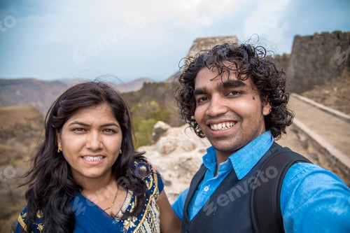 Preview: Indian Couple Taking A Selfie. Man Taking A Selfie With His Wife Or Girlfriend In Front Of Gawilgad