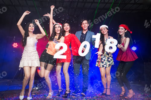 Preview: Group Of Young Asian People Holding Wording 2018 Together In Nightcub. People Have A Party Together