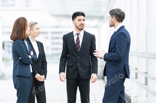Preview: Business Team Relaxing And Chatting