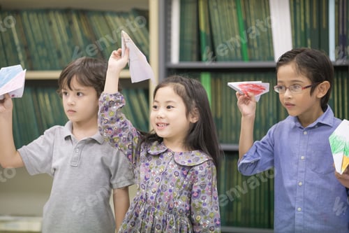 Preview: Portrait Of Children Playing Airplane At Classroom Together, Children With Education Concept.