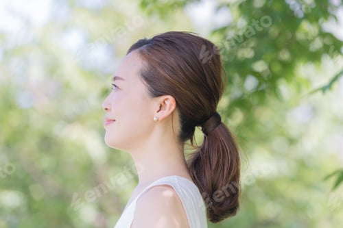Preview: Woman Profile with Lush Green Background