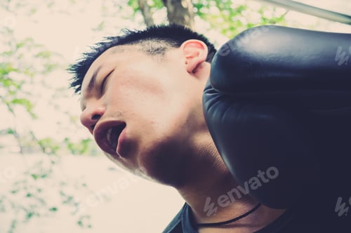 Preview: Close Up Portrait Of Boxer Getting Knocked Out