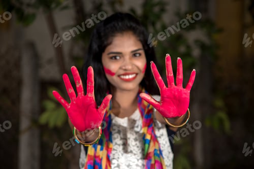 Preview: Young Girl Showing Colourful Palm And Celebrating Holi With Colour Splash