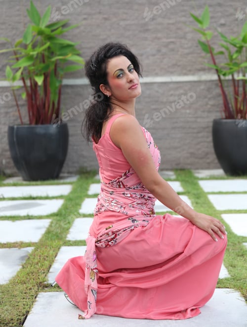 Woman Posing in a Pink Dress Outdoors