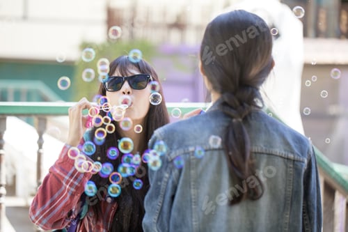 Preview: Portrait Of Asian Woman Blowing Bubble With Happy Emotion, Woman With Activity Concept.
