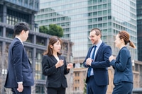 Preview: Business Team Talking On Street