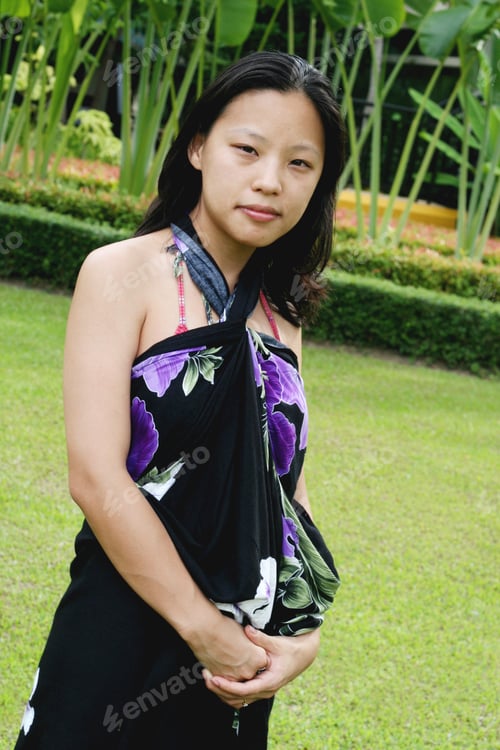 Preview: Portrait Of A Happy Korean Woman Dressed In A Summer Sarong.