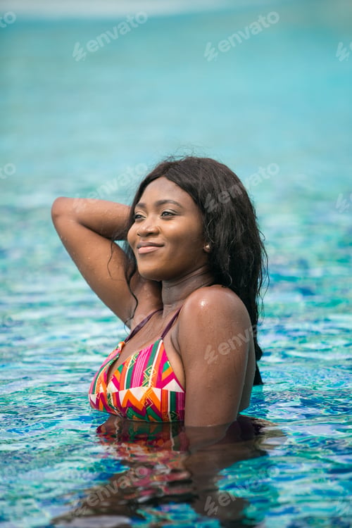 Preview: African Woman In The Swimming Pool During Summer Vacation.
