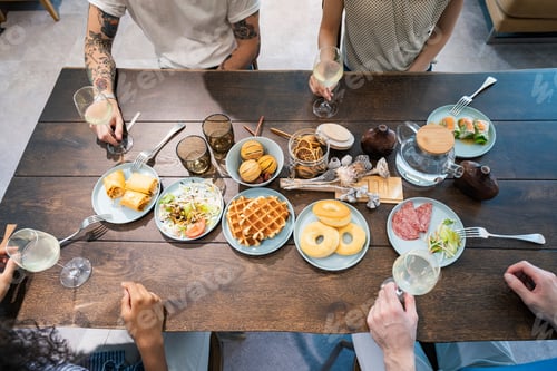 Preview: Scene Of A Home Party Where Men And Women Surround The Dining Table