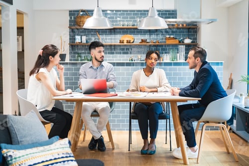 Preview: Businessmen Of Various Races Meeting In A Casual Office Space