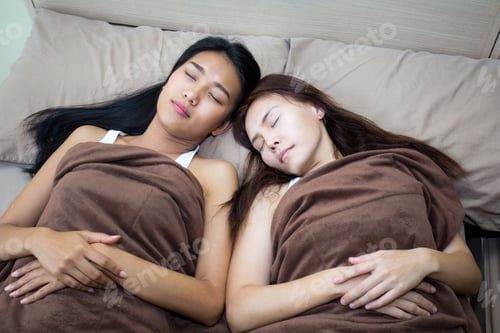 Preview: Close Up Portrait Of Beautiful Asian Woman On Bed With Friend.